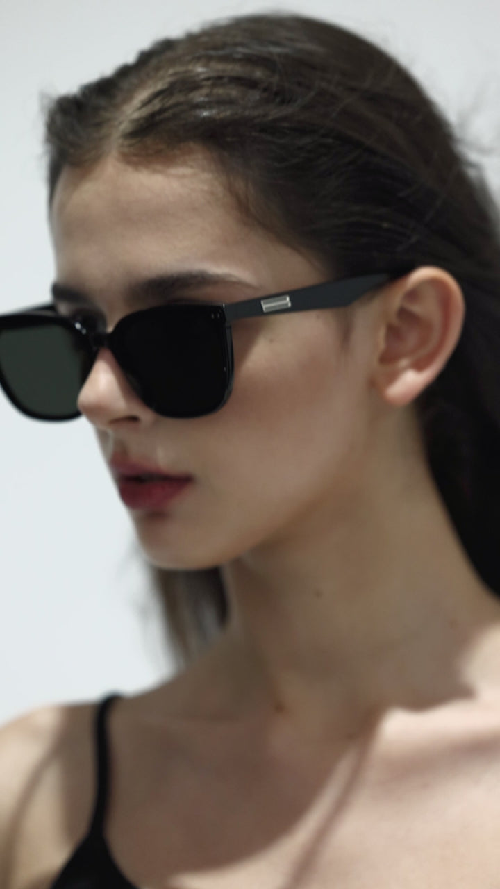 Walking model wearing Artist Designer Sunglasses from Mercury Retrograde