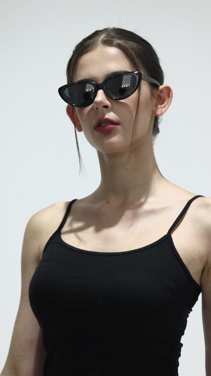 Walking female model wearing Daydream’s BEBE in tortoiseshell Korean Fashion Sunglasses from Mercury Retrograde