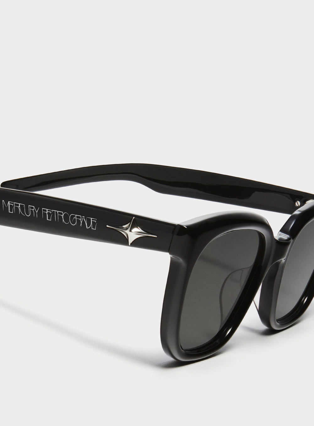 Close-up of Cygnus in black square Sunglasses lenses, high-quality eyewear by Mercury Retrograde Galaxy Collection 