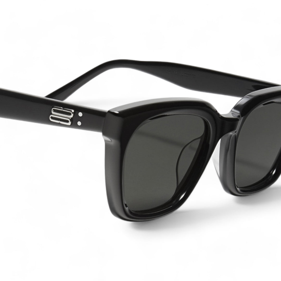 Close-up of Shadow in black square Sunglasses lenses, high-quality eyewear by Mercury Retrograde Burr Puzzle Collection