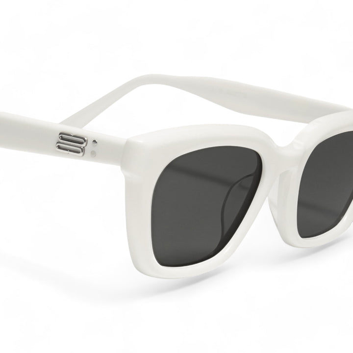 Close-up of Shadow in white square Sunglasses lenses, high-quality eyewear by Mercury Retrograde Burr Puzzle Collection