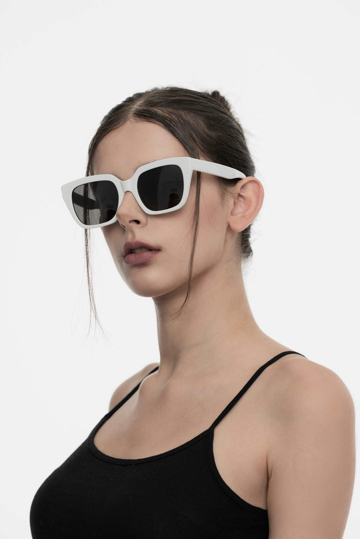 Model wearing Marshmallow in white square Designer Sunglasses from Mercury Retrograde Daydream Collection 