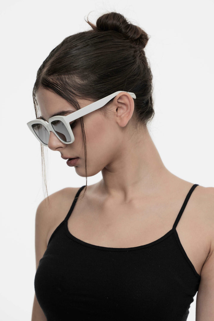 Model of her side face looking down wearing Marshmallow in white square Korean Fashion Sunglasses from Mercury Retrograde Daydream Collection 
