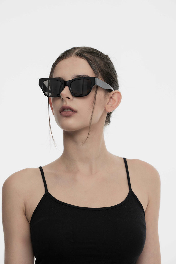 Model of her side face looking up wearing Muse in black square Korean Fashion Sunglasses from Mercury Retrograde Daydream Collection 