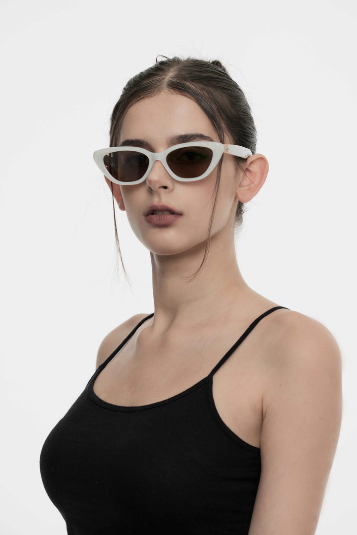 Model wearing Virgo in white cat-eye Designer Sunglasses with UV protection from Mercury Retrograde Galaxy Collection 