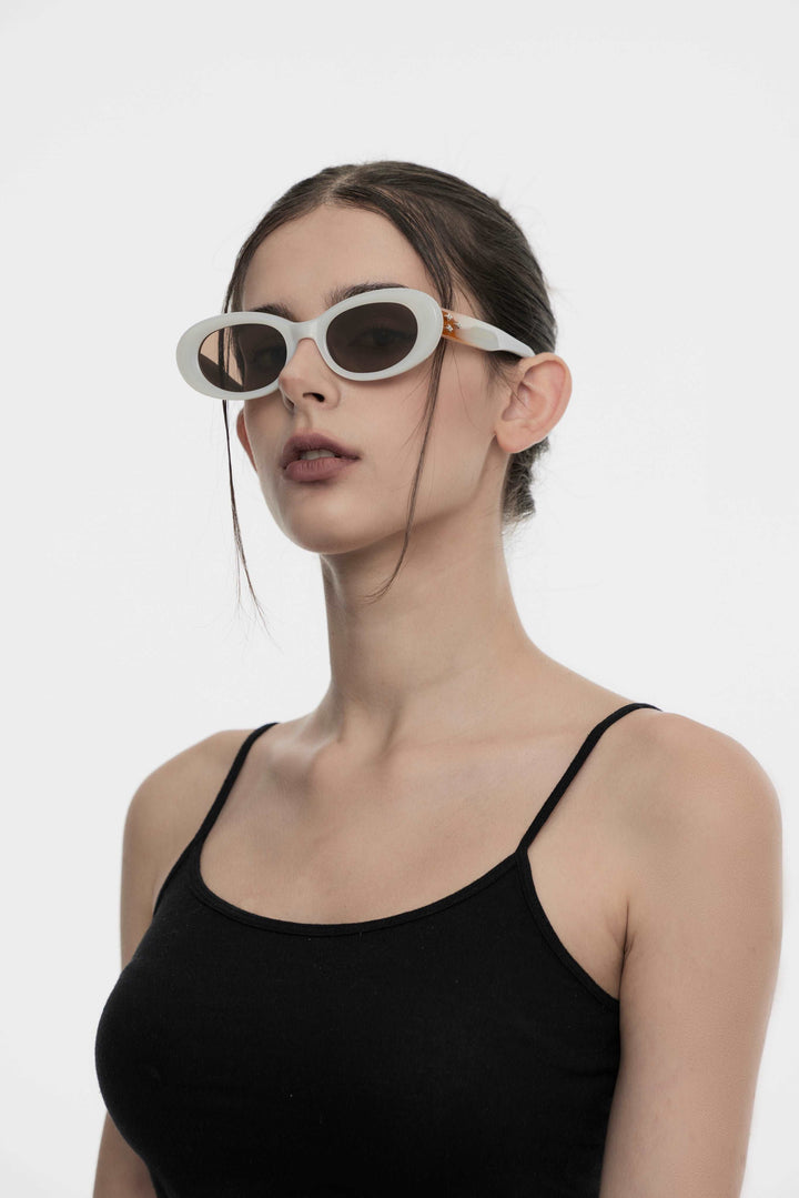 Side profile of model wearing trendy Triangulum in white round Sunglasses from Mercury Retrograde Galaxy Collection 