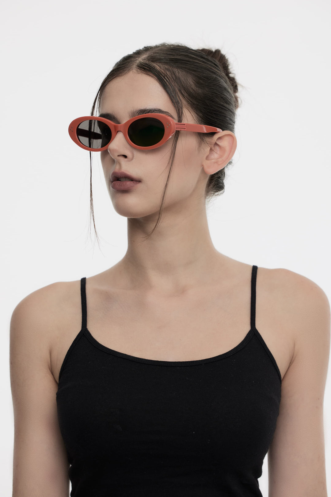 Side profile of model wearing trendy Wave in red round Sunglasses from Mercury Retrograde Burr Puzzle Collection 