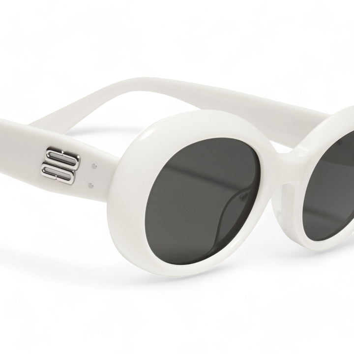 Close-up of Poison in white round Sunglasses lenses, high-quality eyewear by Mercury Retrograde Burr Puzzle Collection