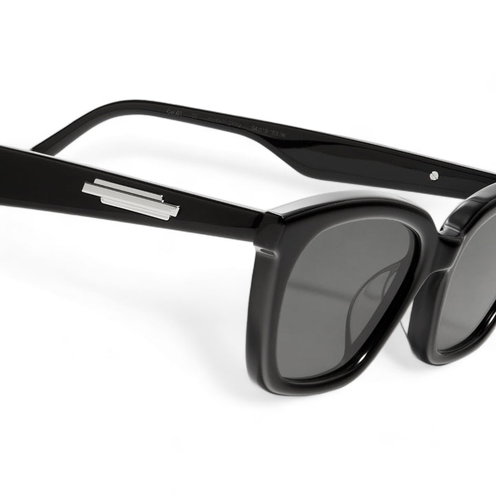 Close-up of Lust in black cat-eye Sunglasses lenses, high-quality eyewear by Mercury Retrograde Burr Puzzle Collection