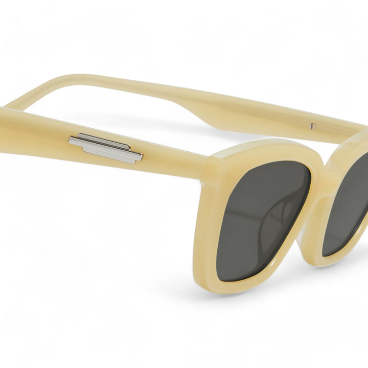 Close-up of Lust in yellow cat-eye Sunglasses lenses, high-quality eyewear by Mercury Retrograde Burr Puzzle Collection