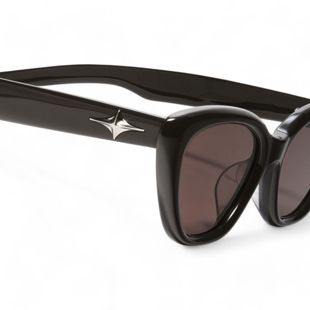 Close-up of Virgo in black cat-eye Sunglasses lenses, high-quality eyewear by Mercury Retrograde Galaxy Collection